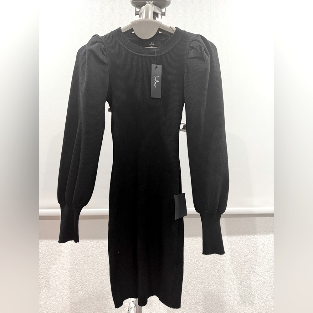 Black tight fit dress. Perfect for cold weather with your favorite pair of boots